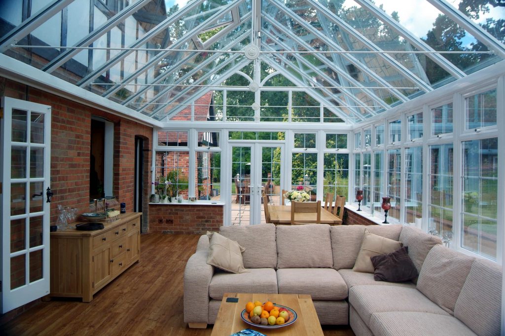 Conservatory glass roof with white upvc windows